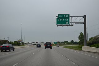I-94/U.S. 52 west at the six-ramp parclo interchange (Exit 350) with 25th Street S. 25th Street heads south by the Bluemont Lakes and Southpointe communities to the city line at 76th Avenue S.