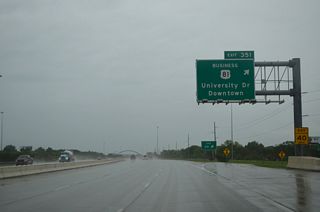 U.S. 81 Business (University Drive) heads north from Exit 351 by the Clara Barton neighborhood toward Downtown Fargo. The route separates along the couplet of  University Drive south and 10th Street north from Hawthorne to the North Dakota State University (NDSU) campus.