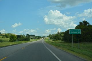 The distance sign referencing the U.S. 10 destination of Moorhead, Minnesota posted east of 13th Avenue SE was removed by 2021.