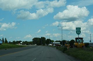 Exit 290 from I-94/U.S. 52 west loops onto the beginning of Main Street east into Valley City. The first reassurance marker for Business Loop I-94 follows 24th Avenue SW, which is part of the business route east from I-94.