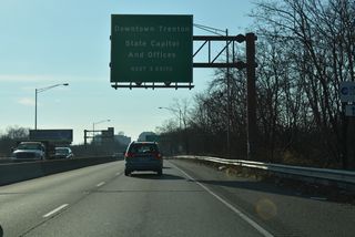The entrance ramp from New York Avenue south of Olden Avenue joins the Trenton Freeway south 0.7 miles ahead of Perry Street, the first of three exits to Downtown Trenton.