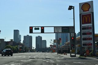 Interstate 78 (12th Street) eastbound at the intersection with Erie Street. Gas stations and other businesses line the four-block stretch of 12th Street between the Newark Bay Extension and Holland Tunnel. I-78 westbound follows 14th Street one block to the north.