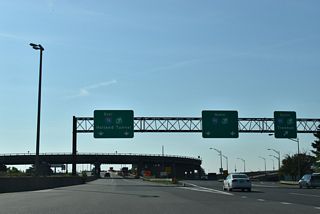 The exit for I-95 and the New Jersey Turnpike mainline part ways with I-78 east beyond the Newark Toll Plaza. I-95 follows the toll road southwest to Woodbridge, New Brunswick and Mansfield Township. Northward the Turnpike splits with the Western Spur to East Rutherford and the Eastern Spur to Secaucus.