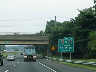 A diamond interchange (Exit 24) joins I-78 with CR 523 (Oldwick Road) a half mile beyond Taylors Mill Road in northern Readington Township. CR 523 leads to CR 517 north for Oldwick and Fairmount.