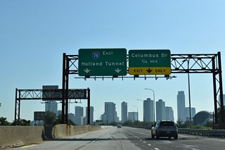 Interstate 78 navigates through an S-curve along a viaduct north to a half diamond interchange with Center and Merseles Streets at Montgomery Street.