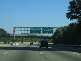 Exit 56 A departs Interstate 80 east for Squirrelwood Road (CR 636) south. CR 636 south ties into CR 633 (Rifle Camp Road) ahead of Garrett Mountain Reservation.