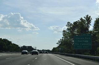 I-80 westbound crosses the Passaic River into Essex County ahead of Exit 52 at Fairfield. Crossing I-80 here is Two Bridges Road midway between U.S. 46 and the borough of Lincoln Park.
