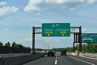 A single lane ramp links I-95 north with the I-80 local lanes west for Bogota, Hackensack, and Lodi while two lanes join the I-80 express lanes west for Paterson and Clifton.