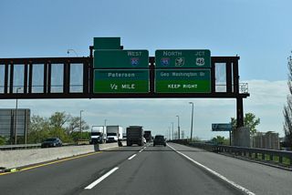 I-95W converges the with NJ Turnpike East Spur just ahead of the Overpeck River separating Ridgefield from Ridgefield Park. Traffic partitions into separate roadways leading to I-80 west to Patterson and the continuation of I-95 north to Fort Lee and the George Washington Bridge.