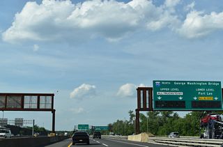Interstate 95 northbound partitions at the east end of I-80 into the local lanes for the George Washington Bridge (GWB) lower deck and the express lanes for the GWB upper deck.