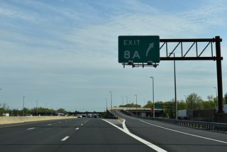 The access road at Exit 8 A leads south from a toll plaza to ramps for both Route 32 (Forsgate Drive) and parallel CR 535 (Cranbury - South River Road).