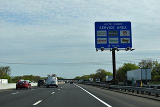Continuing north beyond the original Inner and Outer Roadway split, Interstate 95 advances through an industrial park area through South Brunswick Township. The Joyce Kilmer Service Area is two miles ahead.