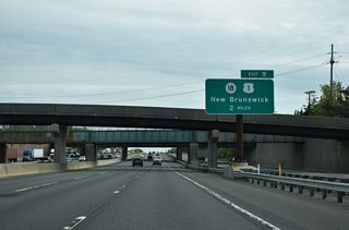 Route 18 links the Turnpike at Exit 9 with nearby U.S. 1 along an expressway spanning Westons Mill Pond.