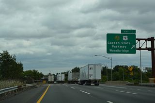 One lane departs the Outer Roadway of Interstate 95 (New Jersey Turnpike) north for the Garden State Parkway. Commercial truck traffic is prohibited from using the Parkway north of Exit 105 in Tinton Falls due to low bridge clearances.