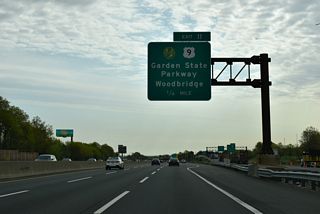 The access roadway from the NJ Turnpike at Exit 11 ties into the Garden State Parkway at a directional T interchange adjacent to CR 501 (King Georges Road) and Route 184 at Fords.