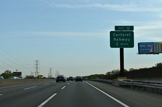 Two miles south of the trumpet interchange (Exit 12) with Roosevelt Avenue (CR 602) and Peter J. Sica Industrial Highway at West Carteret. I-95 enters Carteret, a borough bound by the Rahway River and Arthur Kill between Port Reading and Linden.