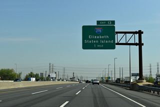 Brooklyn and the Gowanus Expressway section of Interstate 278 are 11.5 miles to the east of Exit 13.