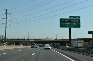 Interstate 278 passes over the New Jersey Turnpike two miles south of Exit 13 A for the Elizabeth Seaport and Route 81 (North Avenue). Route 81 spurs 1.18 miles northwest from Interstate 95 to the freeway along U.S. 1/9 at Newark Liberty International Airport (EWR).