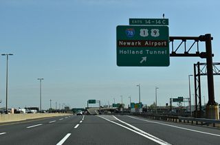 A directional cloverleaf interchange joins I-95 with Interstate 78 at Exit 14. The Newark Bay Extension interchanges are Exit 14 A with Route 440 for Bayonne, Exit 14 B for Jersey City and Liberty State Park, Exit 14 C Holland Tunnel / Liberty State Park.
