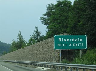 The scenic stretch of I-287 culminates at the borough of Riverdale. Forthcoming Exit 52 is the first of three for the community.
