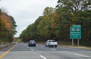 Interstate 287 curves westward and lowers from Second Watchung Mountain into a parclo interchange (Exit 22) with U.S. 202/206 near Pluckemin.
