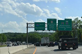 I-287 crosses the NYS&W Railway, the Pequannock River, and Morris County line south just ahead of Exit 53 for CR 694 west into Bloomingdale. New Jersey Route 23 converges with the freeway in a half mile between Butler and Pequannock Township.