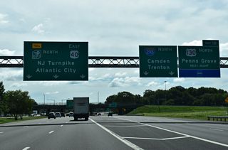 The New Jersey Turnpike and U.S. 40 separate from Interstate 295 northbound within the three quarter cloverleaf interchange (Exits 1 A/B) at U.S. 130 north and Route 49 (Broadway) east in Deepwater.