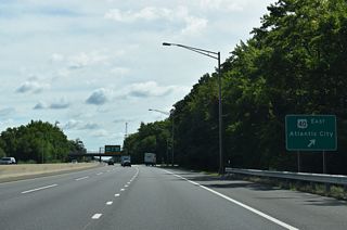 The unnumbered exit for U.S. 40 (Wiley Road) east to Woodstown, Malaga, Mays Landing, and Atlantic City departs the New Jersey Turnpike beyond the I-295 northbound overpass.