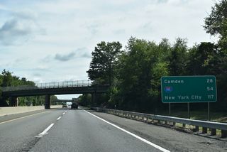Pointers-Auburn Road (CR 646) and Woodstown-Auburn Road (CR 602) cross the New Jersey Turnpike northbound beyond this distance sign.