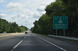 One mile south of the trumpet interchange (Exit 2) and access road to U.S. 322. U.S. 322 travels 0.8 miles west to CR 551 (Kings Highway) south into the borough of Swedesboro and 3.8 miles to Interstate 295 in Logan Township.