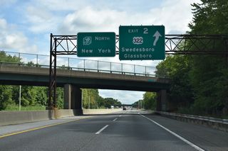Exit 2 leaves the New Jersey Turnpike beyond the Back Creek Road overpass east of Swedesboro. U.S. 322 crosses the tolled Commodore Barry Bridge over the Delaware River between Bridgeport and Chester, Pennsylvania.
