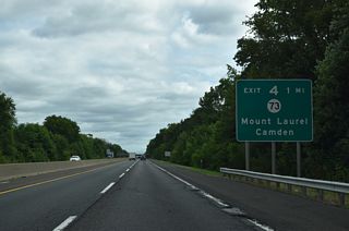 North from the trumpet interchange at Exit 4, Route 73 provides two connections to Philadelphia, Pennsylvania. Route 90 branches west from Route 73 in 4.3 miles along a freeway to the Betsy Ross Bridge to I-95 at Bridesburg. Crossing the Tacony-Palmyra Bridge, PA 73 leads into Philadelphia at Tacony.