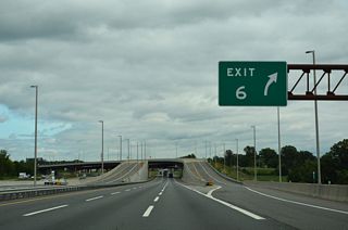 Ramps at Exit 6 for Interstate 95 south to I-276 west separate from the inner and outer roadways along the Turnpike northbound beyond Mill Lane.