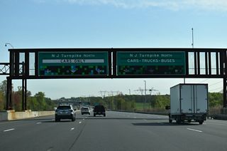 The New Jersey Turnpike northbound divides into two roadways across Crafts Creek ahead of the CR 628 (Hedding Jacksonville Road) over crossing. The inner/outer roadway configuration extends north to the exchange with I-78 in Newark.