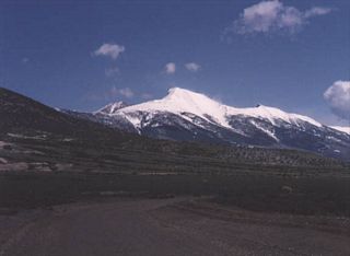 The view of Mount Wheeler (elevation 13,063 feet above sea level) from U.S. 6-50-93 southeast of Ely. Mount Wheeler forms the highest part of Great Basin National Park, famous for the Lehman Caves and an alpine climate in the middle of the desert.