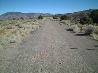 Bypasssed in an effort to straighten out the roadway, an old alignment of U.S. 6 on the eastern descent from Montgomery Pass. Various sections of the original U.S. 6 are visible on both sides of U.S. 6 within the vicinity of Montgomery Pass.