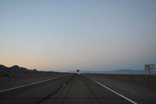 Reassurance markers for U.S. 6/95 precede Esmeralda County milepost 32 and a passing zone.