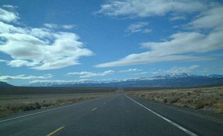 The Sierra Nevada loom in the distance as U.S. 6 west approaches the California-Nevada State Line. Photo taken 1/20/02.