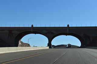 The truck climbing lane from Exit 2 ends just beyond the wildlife overcrossing south of the scenic overlook.