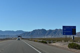 A travel time advisory signs precedes the Buchanan Boulevard under crossing.