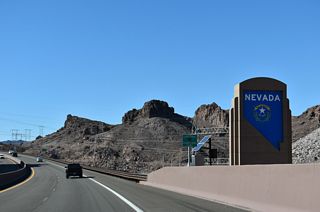 A Nevada monument takes the place of a welcome sign along I-11/U.S. 93 northbound at the end of the Mike O' Callaghan-Pat Tillman Memorial Bridge. The Silver State was established October 31, 1864, during the Civil War.

