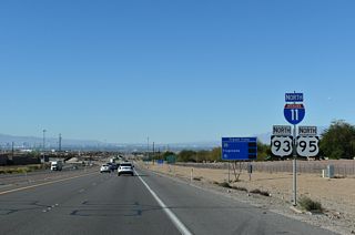 This shield assembly follows the Paradise Hills Drive underpass. It replaced what was the first confirming marker for Interstate 515 north by August 2017, when the first phase of I-11 opened to traffic.