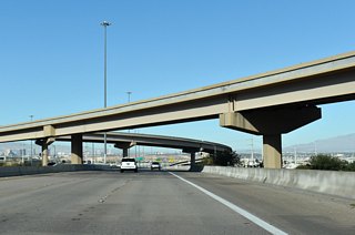 The Henderson Bowl interchange was constructed between 2004 and 2006. Construction anticipated to begin by early 2028 redesigns the exchange into a crossover style interchange, where east to west movements cross at grade separations outside the central interchange (NDOT, n.d.).