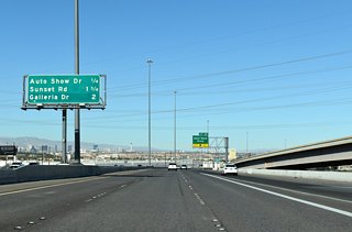I-11/U.S. 93-95 (Oran K. Gragson Freeway) connects with Auto Show Drive next, followed by Sunset Road at Exit 64 to Harry Reid International Airport (LAS) and Galleria Drive at Exit 65.
