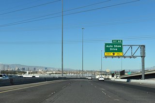 The diamond interchange (Exit 62) with Auto Show Drive was added by 2006. As the name implies, numerous auto dealerships surround three quadrants of the exchange.