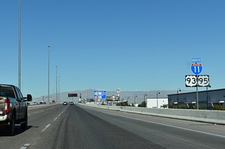 Succeeding entrance ramps join I-11/U.S. 93-95 northbound beyond the Auto Show Drive overpass.