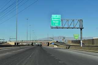 One mile separates Galleria Drive from Exit 65 to Russell Road along I-11 (Oran K. Gragson Freeway) north.