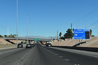 Travel time sign indicating typical congestion along Interstate 11 leading northwest to Downtown Las Vegas and I-15 at the Spaghetti Bowl.