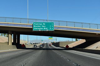 A parclo interchange (Exit 69) joins I-11 with Flamingo Road east to SR 582 (Boulder Highway) and west to the central part of the Strip.