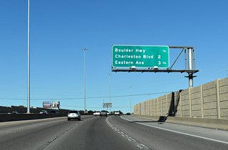 I-11/U.S. 93-95 (Oran K. Gragson Freeway) shift northwest between the Homewood Park and Plata Del Sol West subdivisions ahead of Boulder Highway (SR 582).